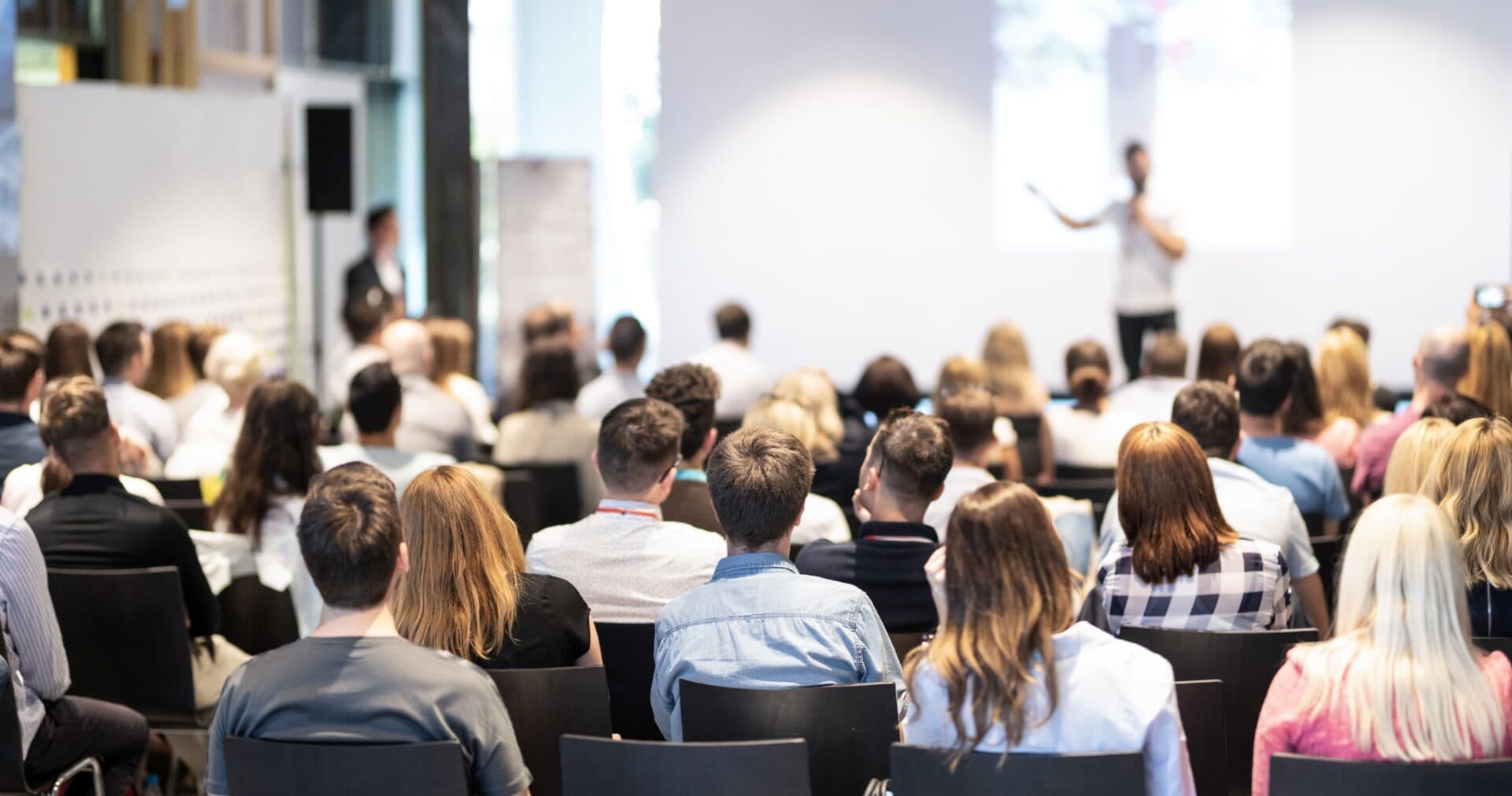 People listening to a conference.