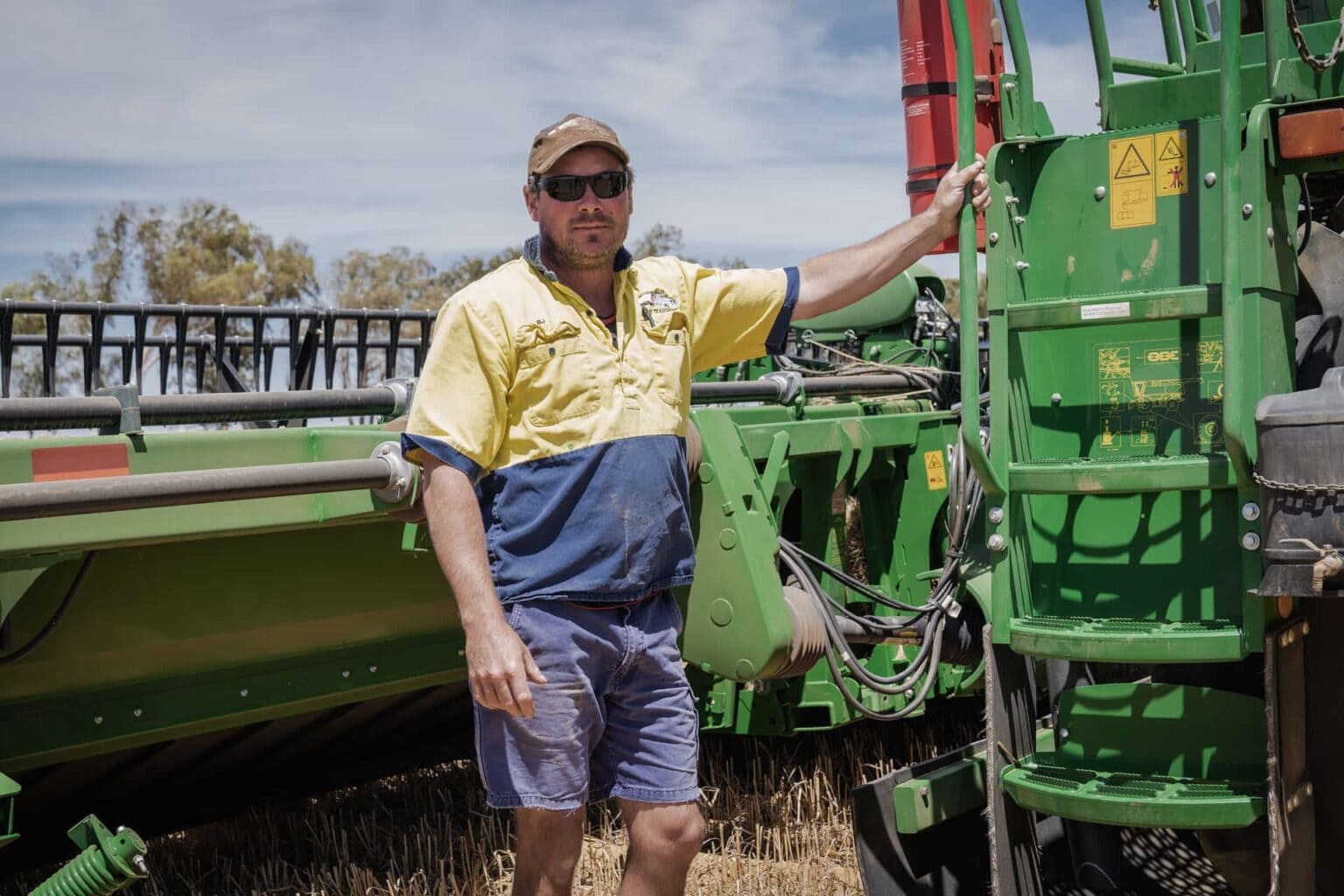 workman with green tractor